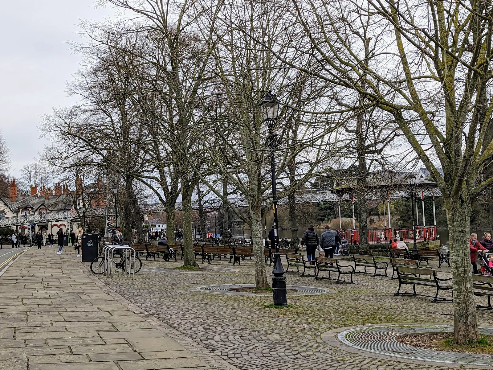 Benches and lamps along the Groves under bare winter trees