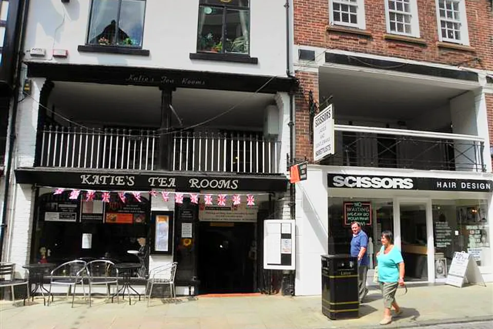 The front of Katie's Tea Rooms on Watergate Street, with tables outside