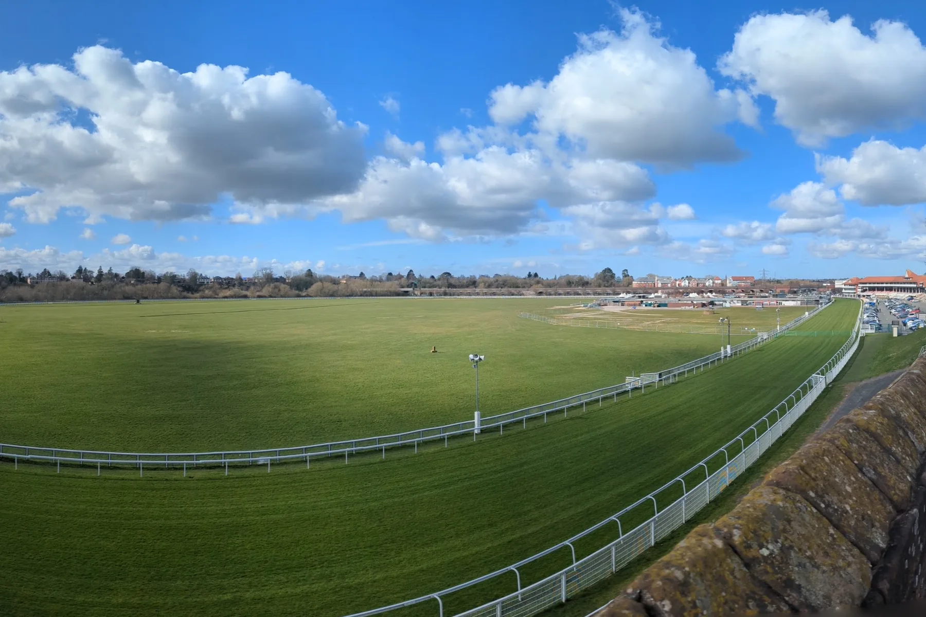Chester Racecourse, the Roodee, seen from the city walls under a blue sky