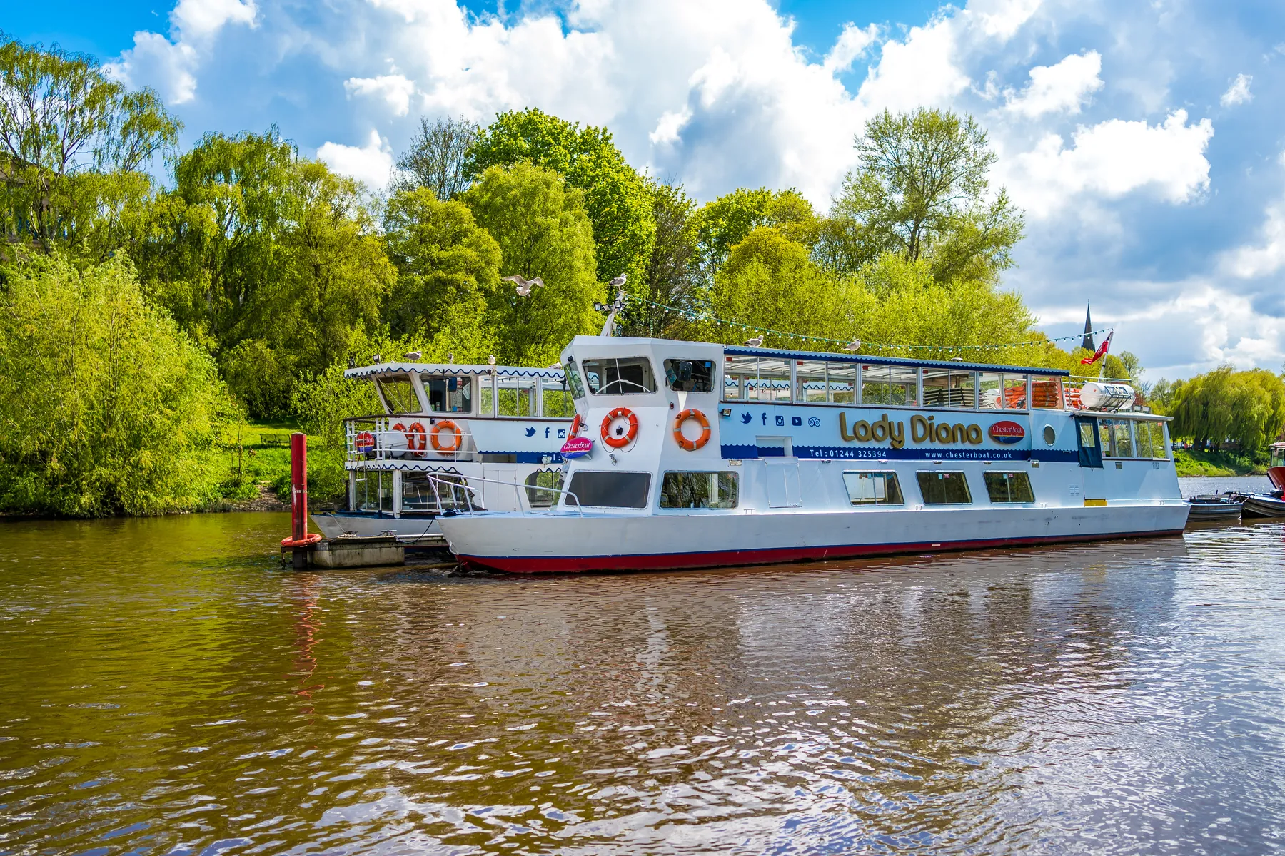 A river cruise boat on the River Dee on a summer day