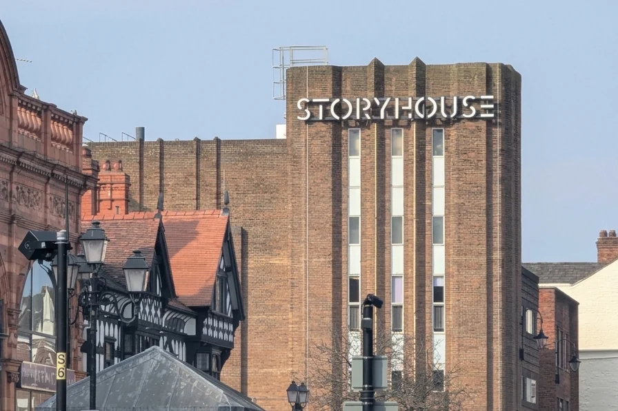 The Storyhouse tower and sign above the Chester rooftops