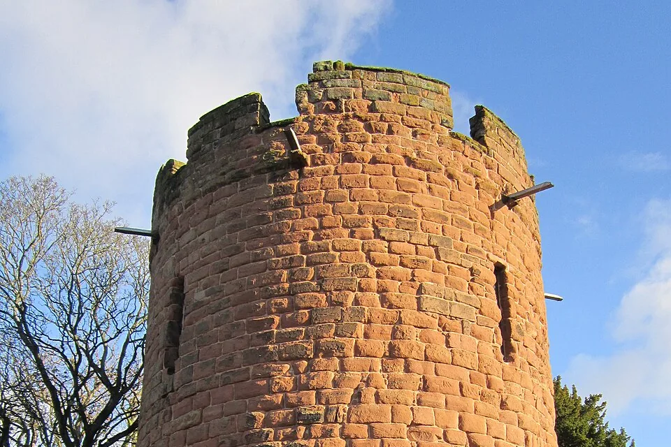 The round red sandstone Water Tower on Chester's city walls against a blue sky