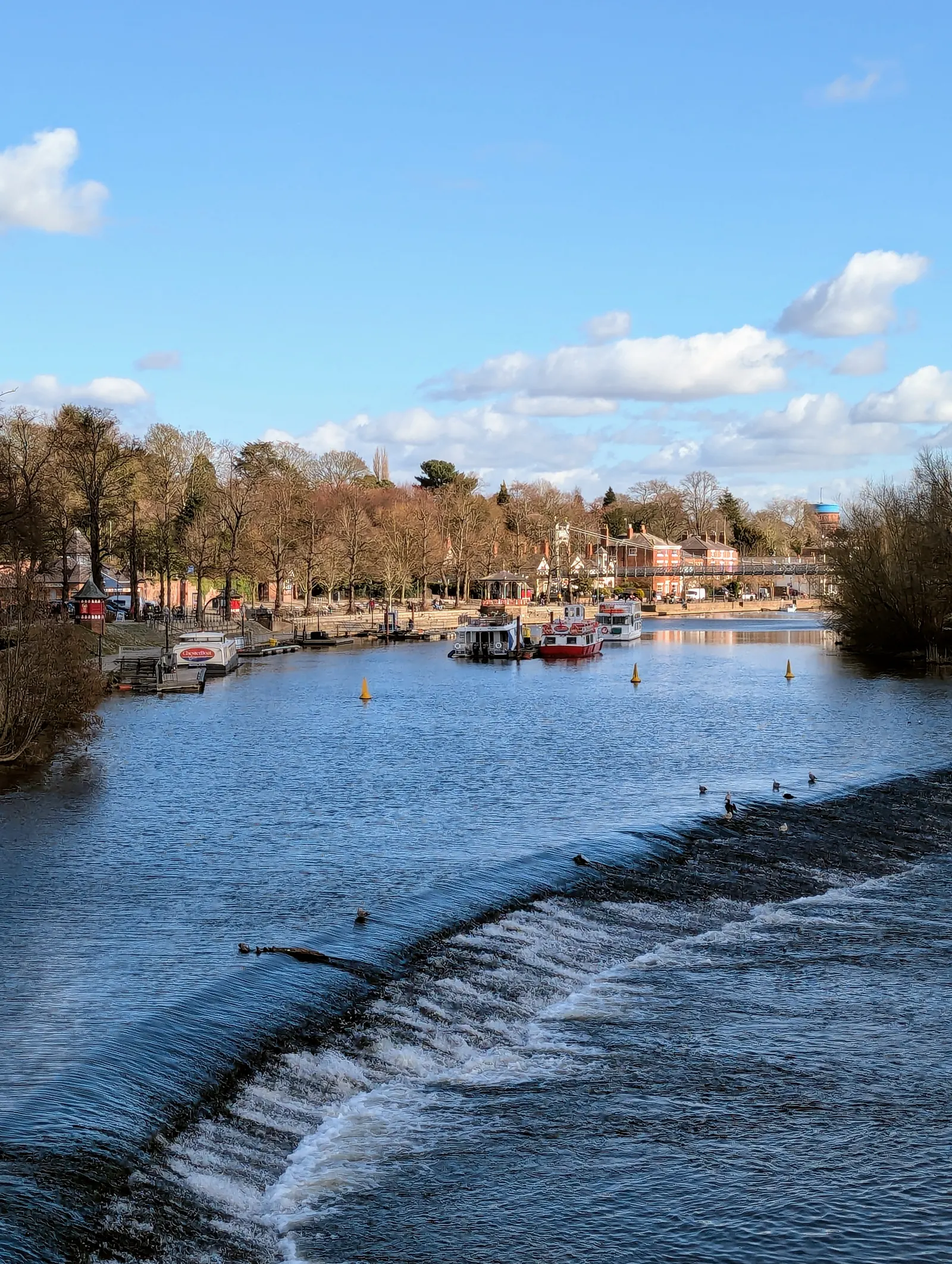 Boats moored on the River Dee at the Groves in early spring