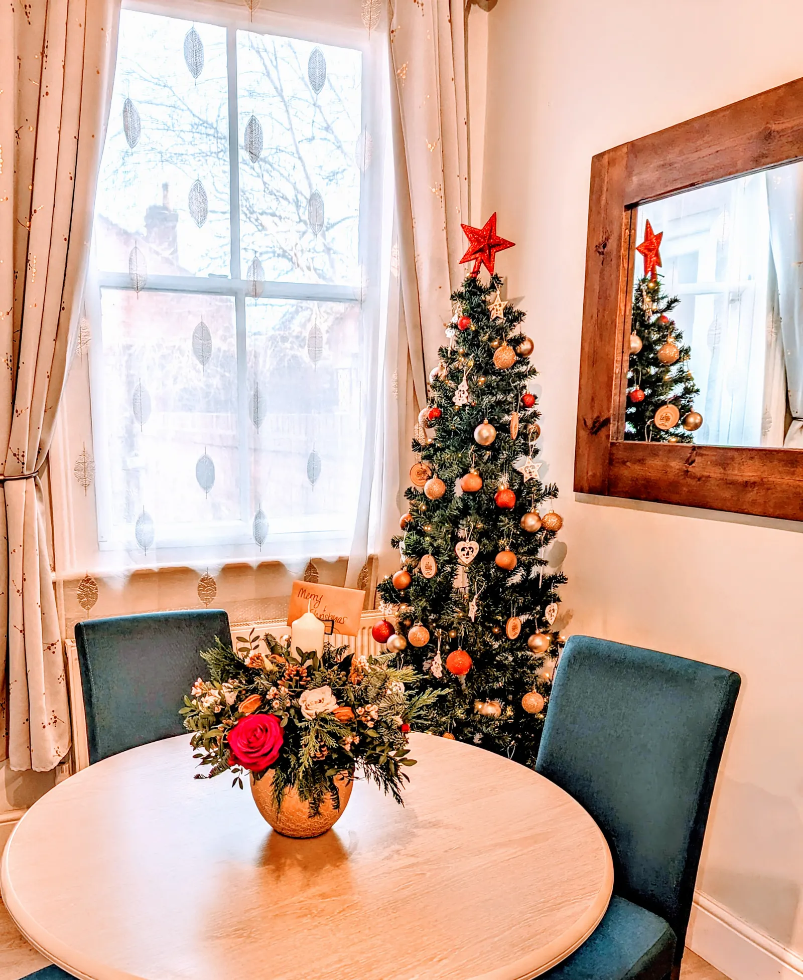 Decorated Christmas tree by the window in the living room