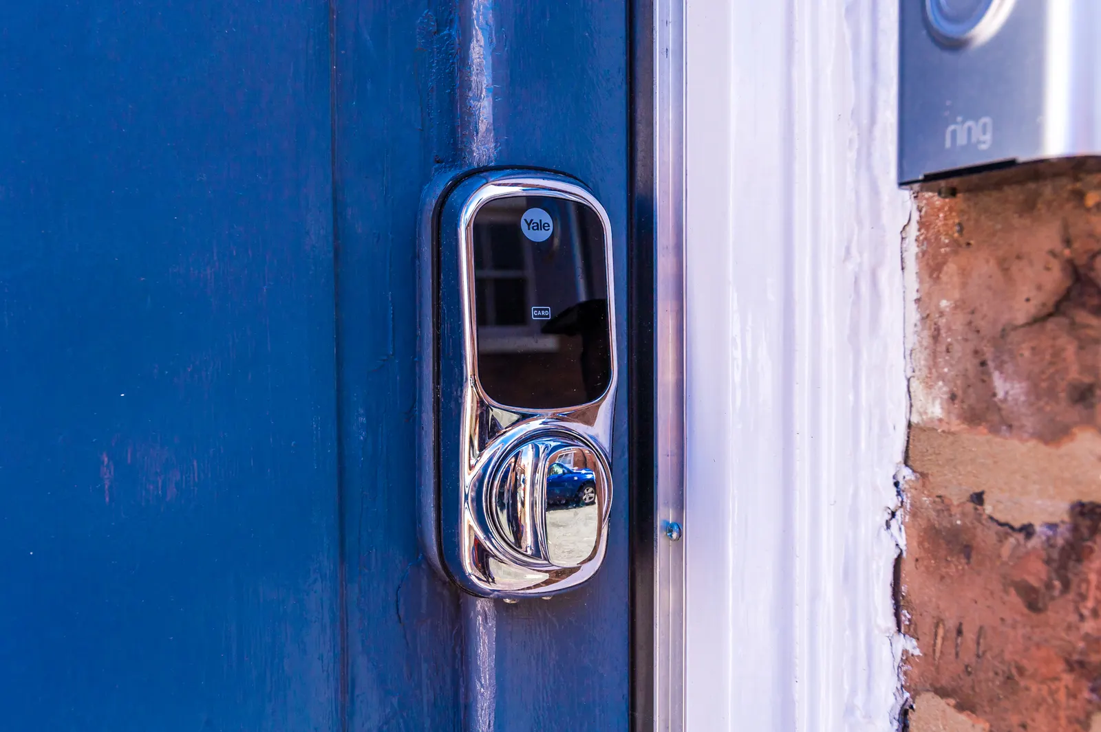 Keyless smart lock on the blue front door for flexible self check-in