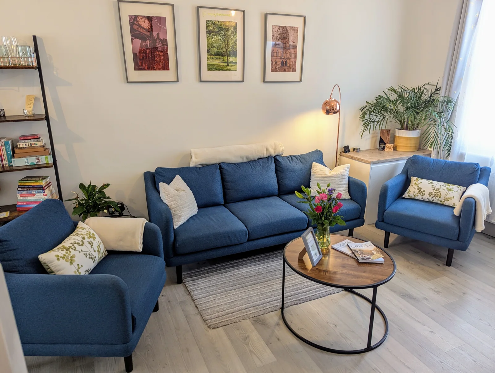Blue armchairs and coffee table in the bright lounge